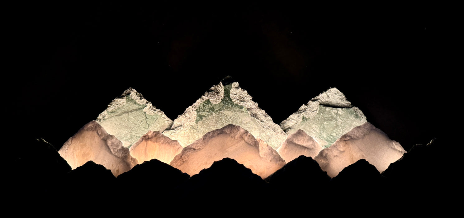 Illuminated marble mountainscape.