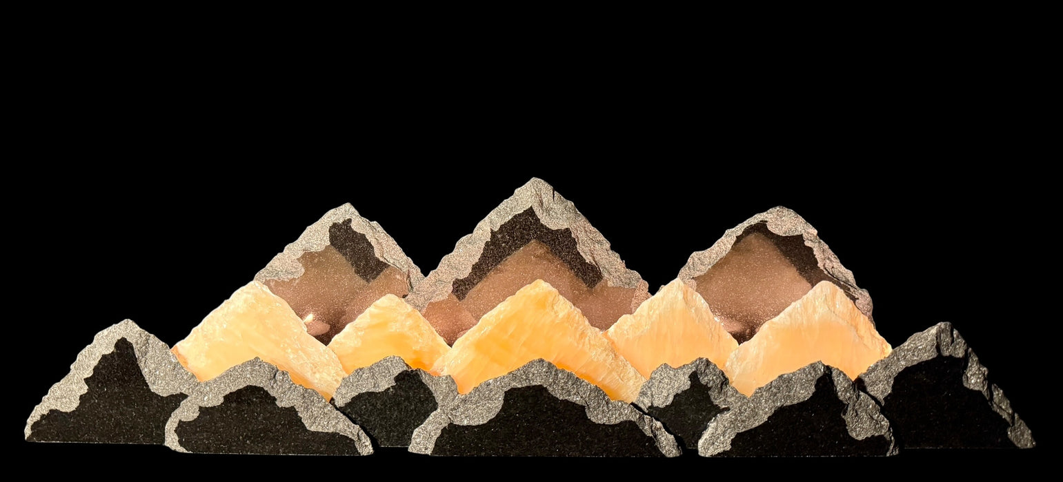 Illuminated University of Colorado onyx mountainscape.