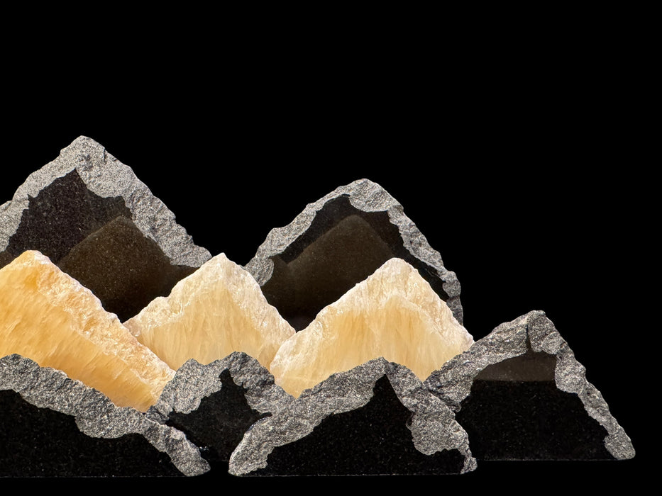 Illuminated University of Colorado onyx mountainscape.